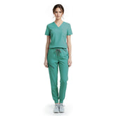 Vicogard Turquoise performance jogger scrub set front view, bright V-neck top with badge loop