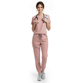 Pediatric nurse wearing Pink performance scrubs ready for active patient care