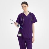 Grape purple Vicogard® clinical scrub set modeled by healthcare worker