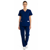 Front view of model in the classic vicogard Pro Custom Unisex Scrub Set in Navy