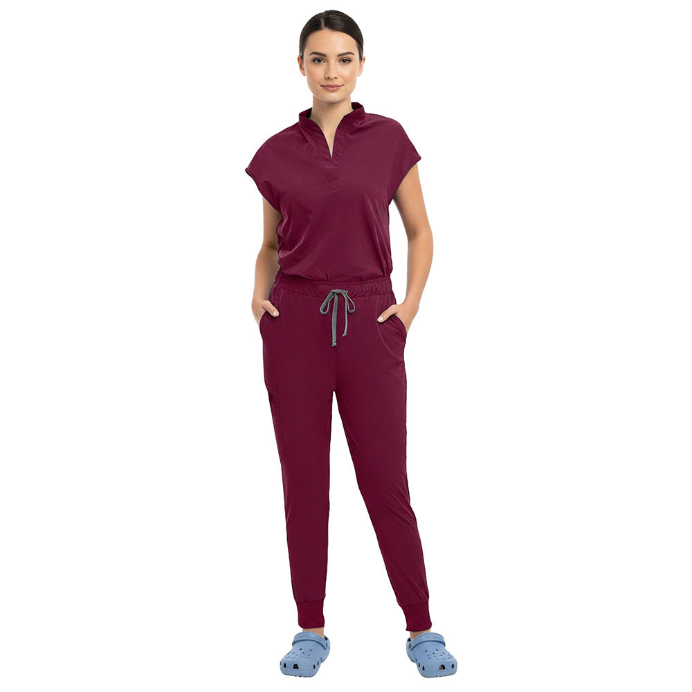 Close up of Burgundy surgical scrub pants showing elastic waistband and drawstring detail