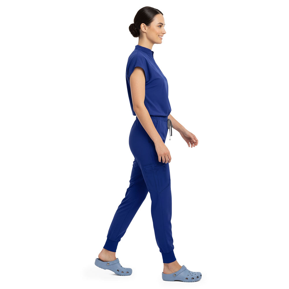 Side profile of Royal Blue scrub pants showing zippered cargo pocket on leg
