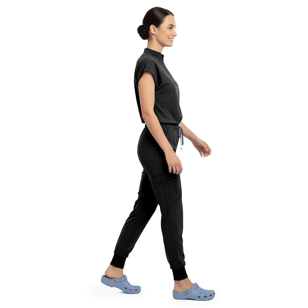 Side profile of Black scrub pants showing zippered cargo pocket on leg