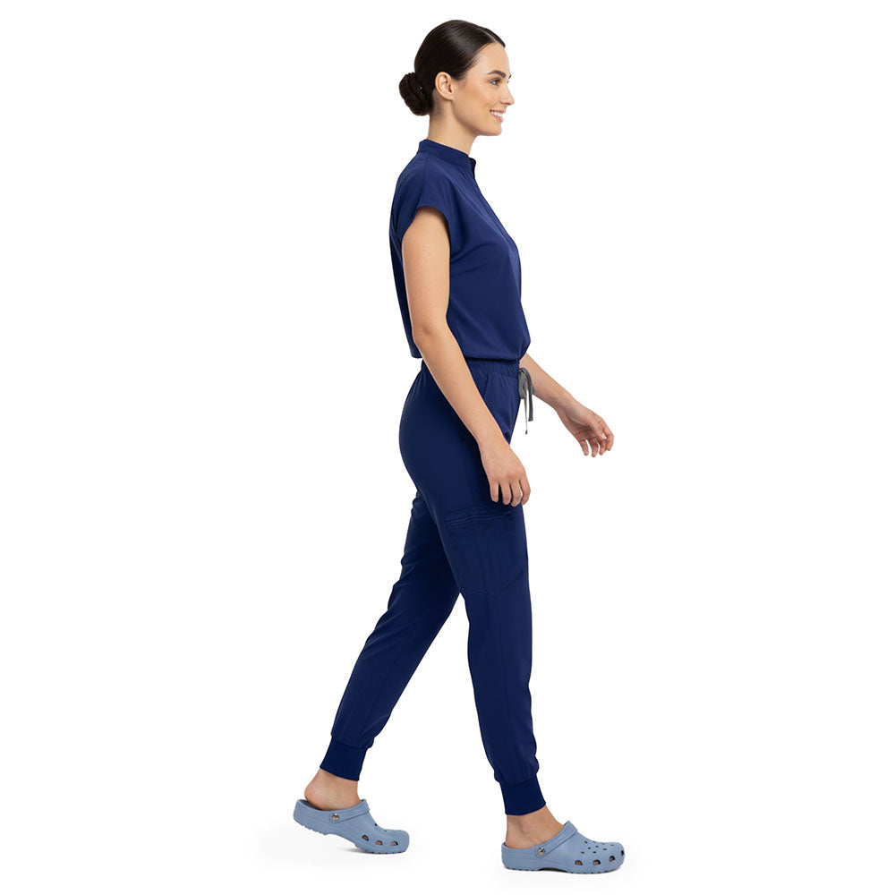 Side profile of Navy Blue scrub pants showing zippered cargo pocket on leg