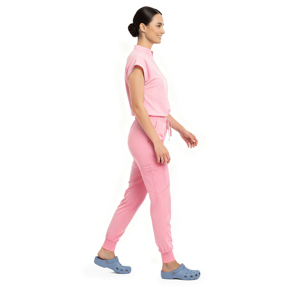 Side profile of Pink scrub pants showing zippered cargo pocket on leg