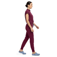 Side profile of Burgundy scrub pants showing zippered cargo pocket on leg