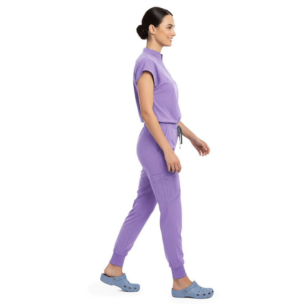 Side profile of Lavender scrub pants showing zippered cargo pocket on leg