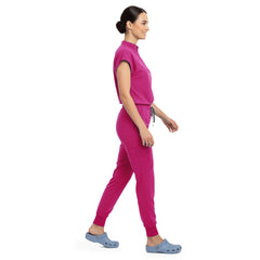 Side profile of Rose Pink scrub pants showing zippered cargo pocket on leg