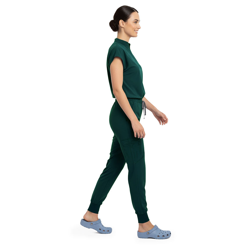 Side profile of Hunter Green scrub pants showing zippered cargo pocket on leg