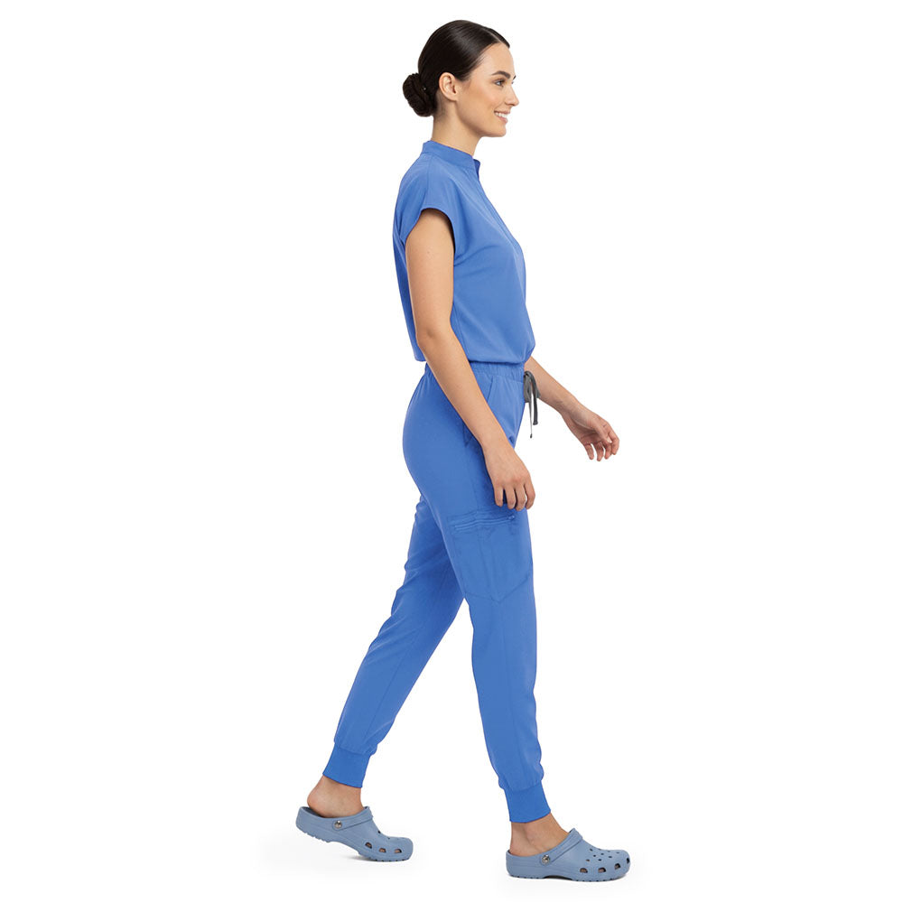 Side profile of Ceil Blue scrub pants showing zippered cargo pocket on leg