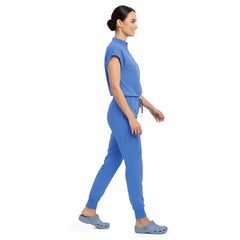 Side profile of Ceil Blue scrub pants showing zippered cargo pocket on leg