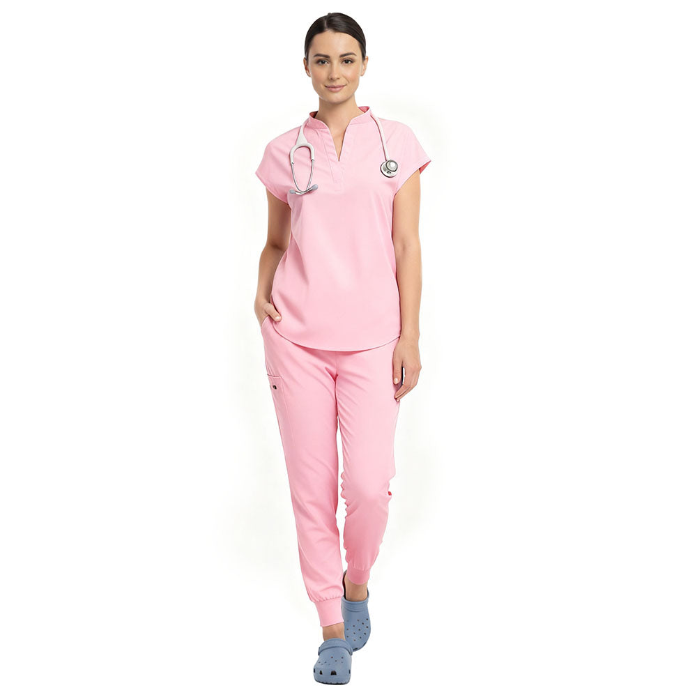 Pediatric surgeon wearing Pink sterile-safe scrubs in a professional medical setting