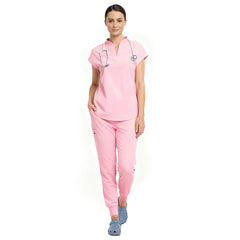 Pediatric surgeon wearing Pink sterile-safe scrubs in a professional medical setting