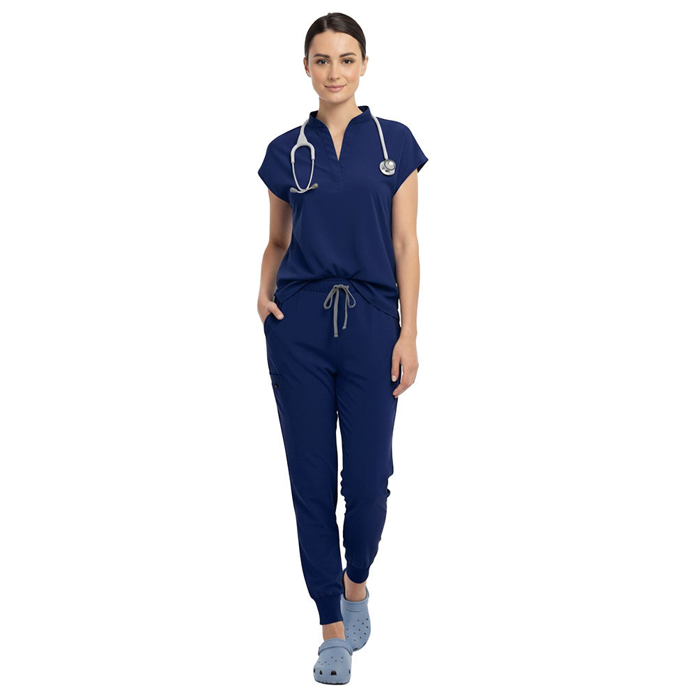 Surgeon wearing Navy Blue sterile-safe scrubs in a professional OR setting