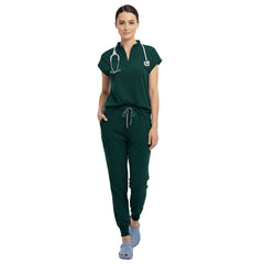 Surgeon wearing Hunter Green sterile-safe scrubs in a standard operating room