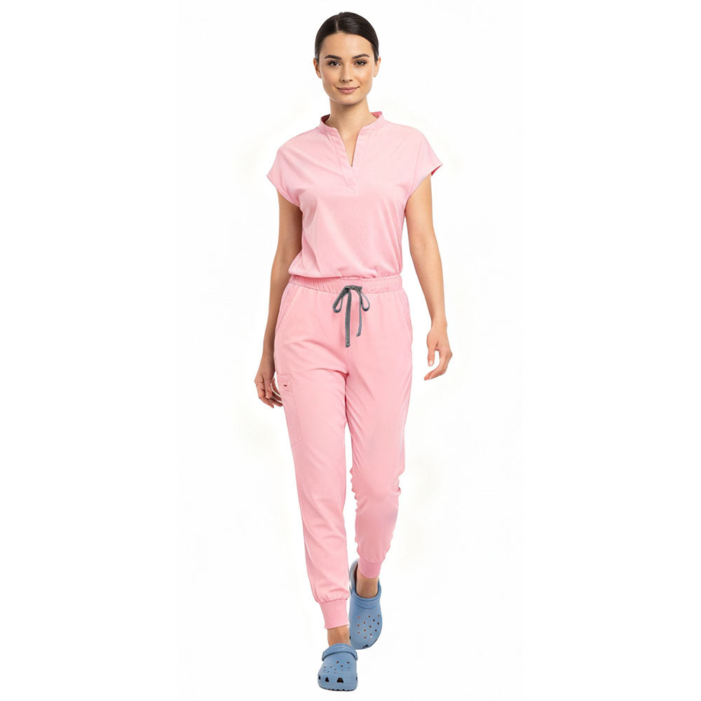 Medical professional stretching in Pink 4-way stretch uniform showing flexibility