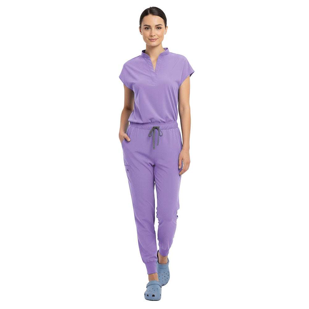 Doctor demonstrating side pocket access on Lavender zipper cargo pants