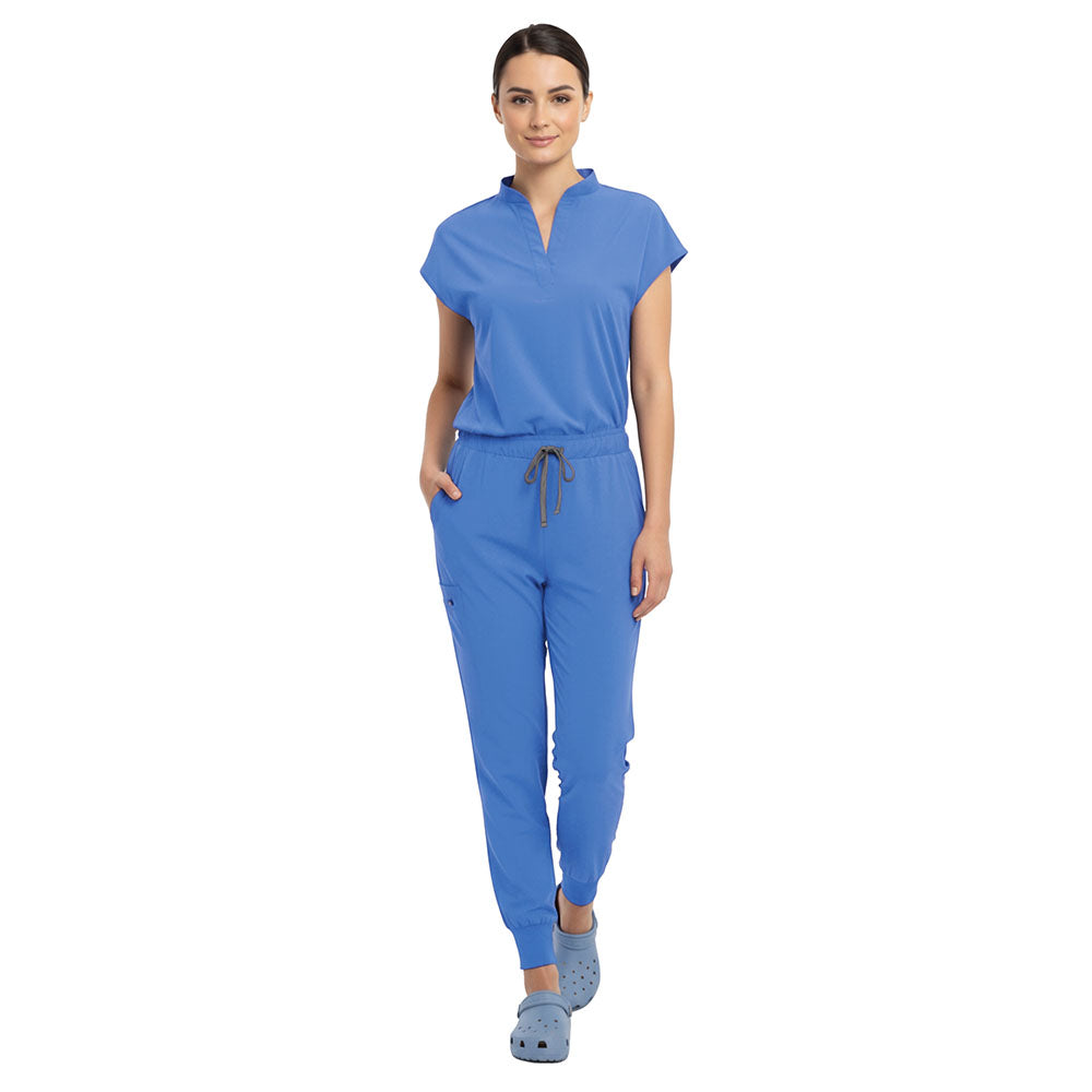 Doctor demonstrating side pocket access on Ceil Blue zipper cargo pants