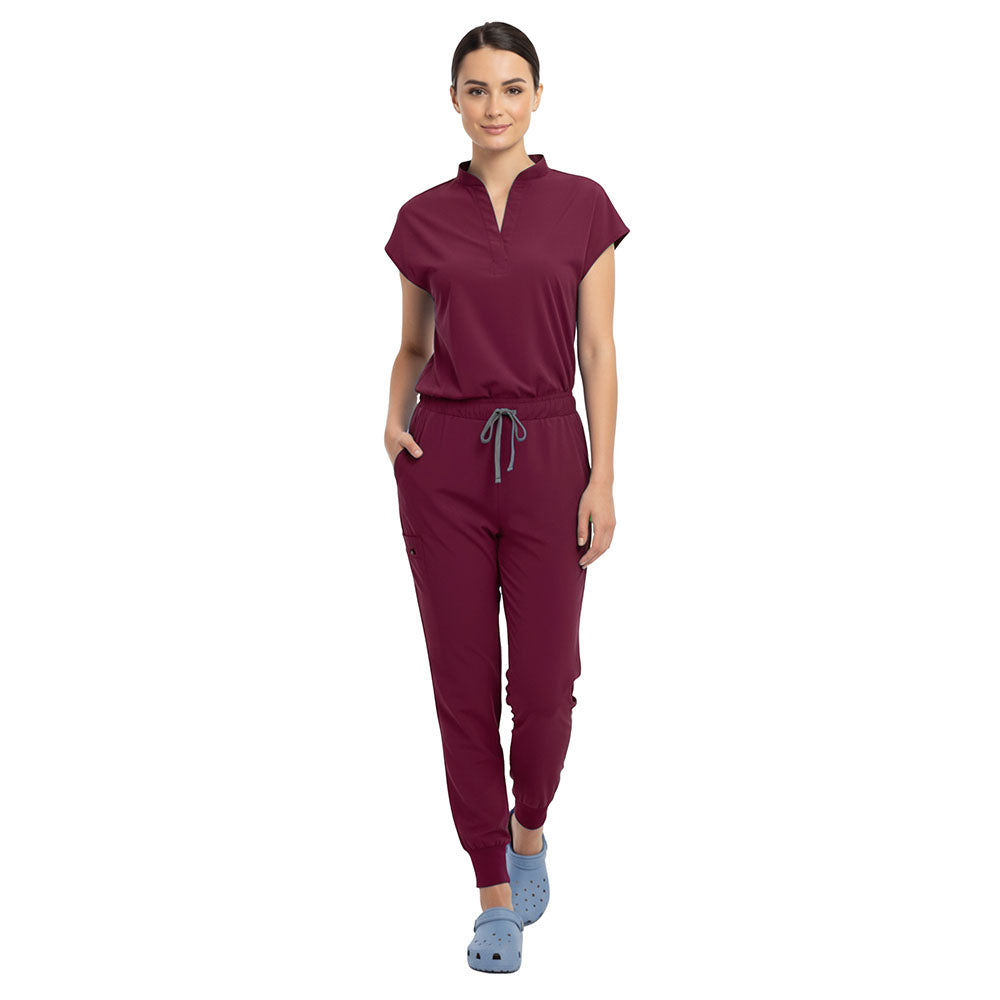 Doctor demonstrating side pocket access on Burgundy zipper cargo pants
