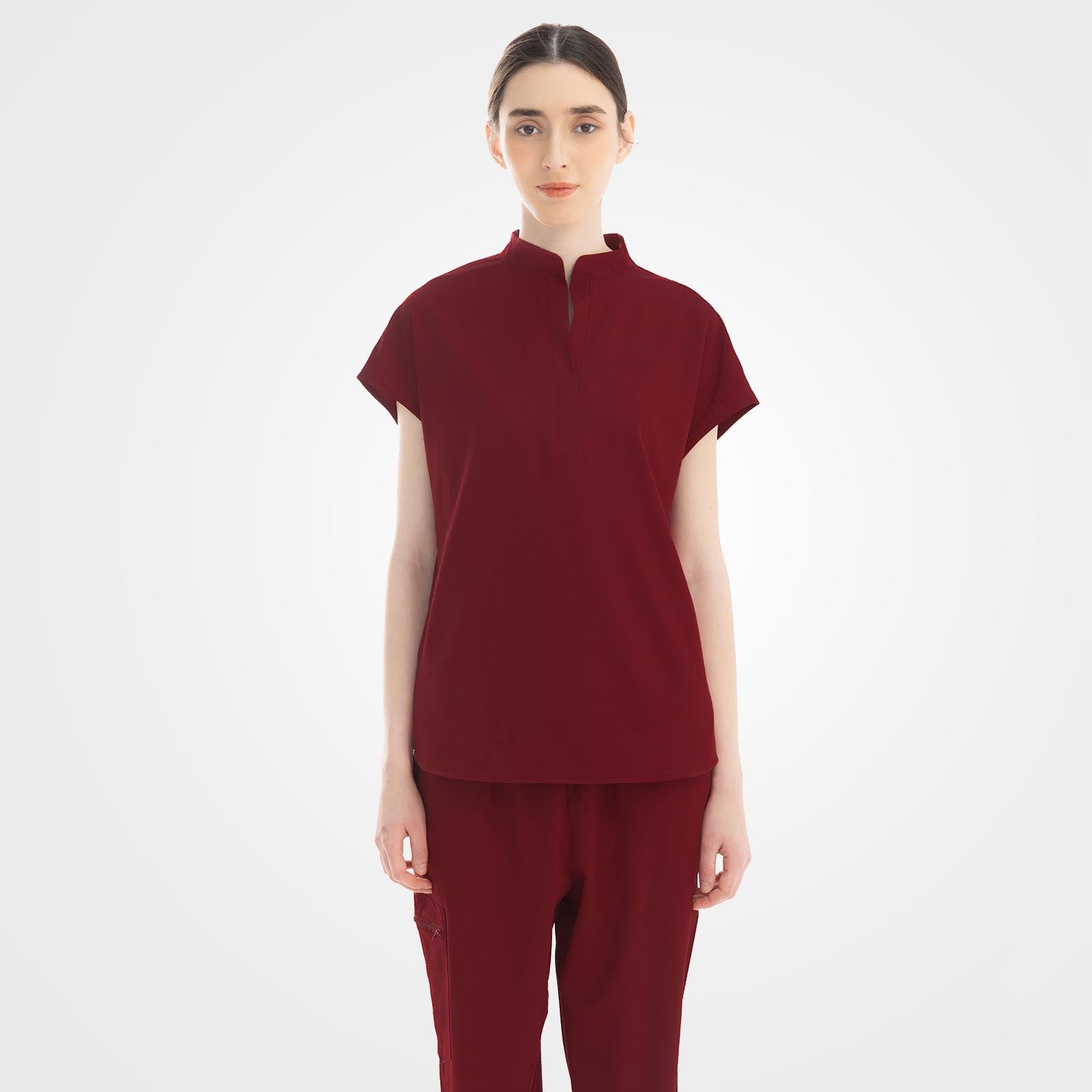 Women's elegant burgundy slim fit scrubs on model