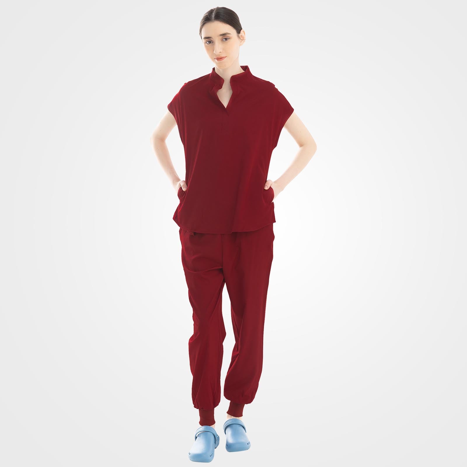 Burgundy scrub top with hidden pockets and cargo pants front