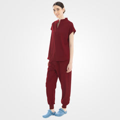 Wine red medical spa scrubs side profile showing zippered pocket