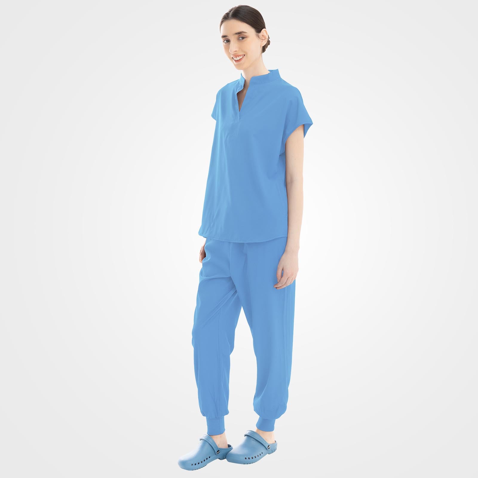 Light blue medical scrubs side profile showing zippered pocket
