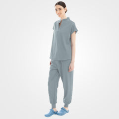 Versatile grey scrubs side profile showing zippered pocket