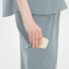 Minimalist grey scrub top hidden side hem pocket