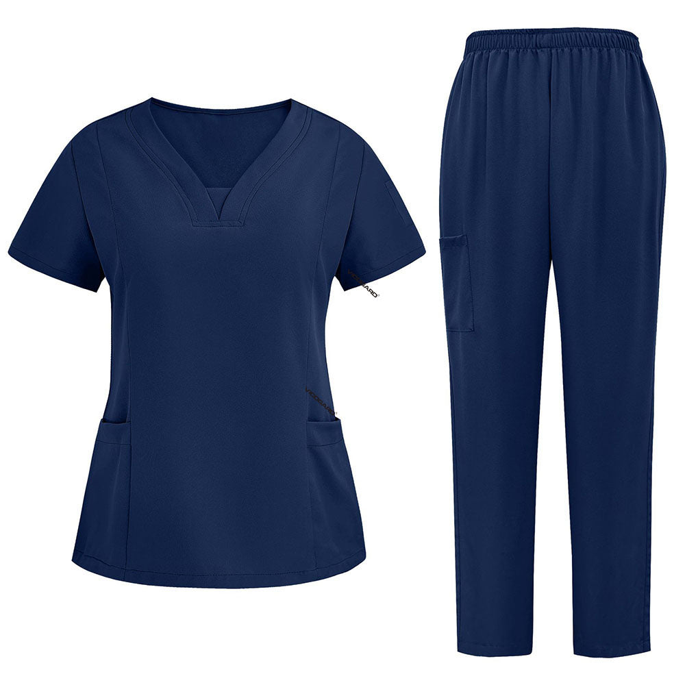 Flat lay of Navy Blue 3-pocket scrub set featuring V-neck top and straight leg pants