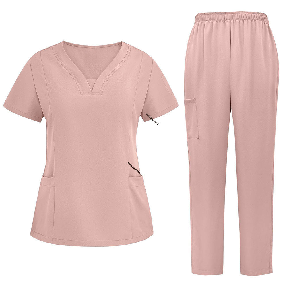 Flat lay of Pink 3-pocket scrub set featuring V-neck top and straight leg pants