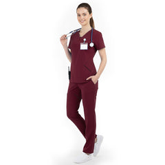 Side profile of Burgundy nursing scrubs showing relaxed straight leg fit and drape