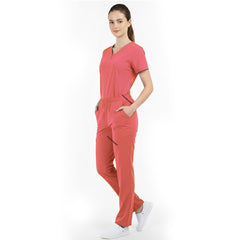 Model placing hand in pocket of Orange Red scrub pants, showing functionality