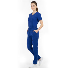 Model placing hand in pocket of Royal Blue scrub pants, showing functionality and fit