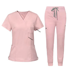 Flat lay of Pink utility scrub set featuring 3-pocket top and 8-pocket jogger pants
