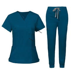 Flat lay of Caribbean Blue utility scrub set featuring 3-pocket top and 8-pocket jogger pants