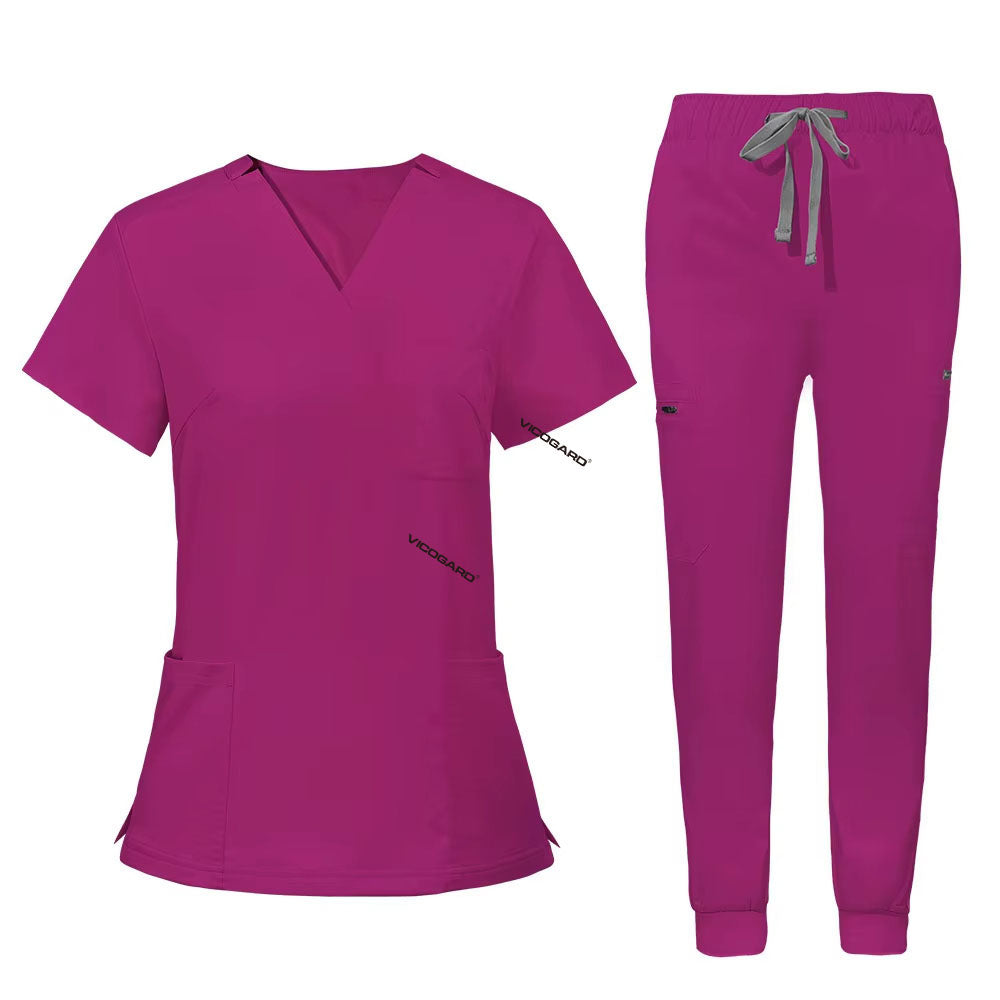 Flat lay of Rose Pink utility scrub set featuring 3-pocket top and 8-pocket jogger pants