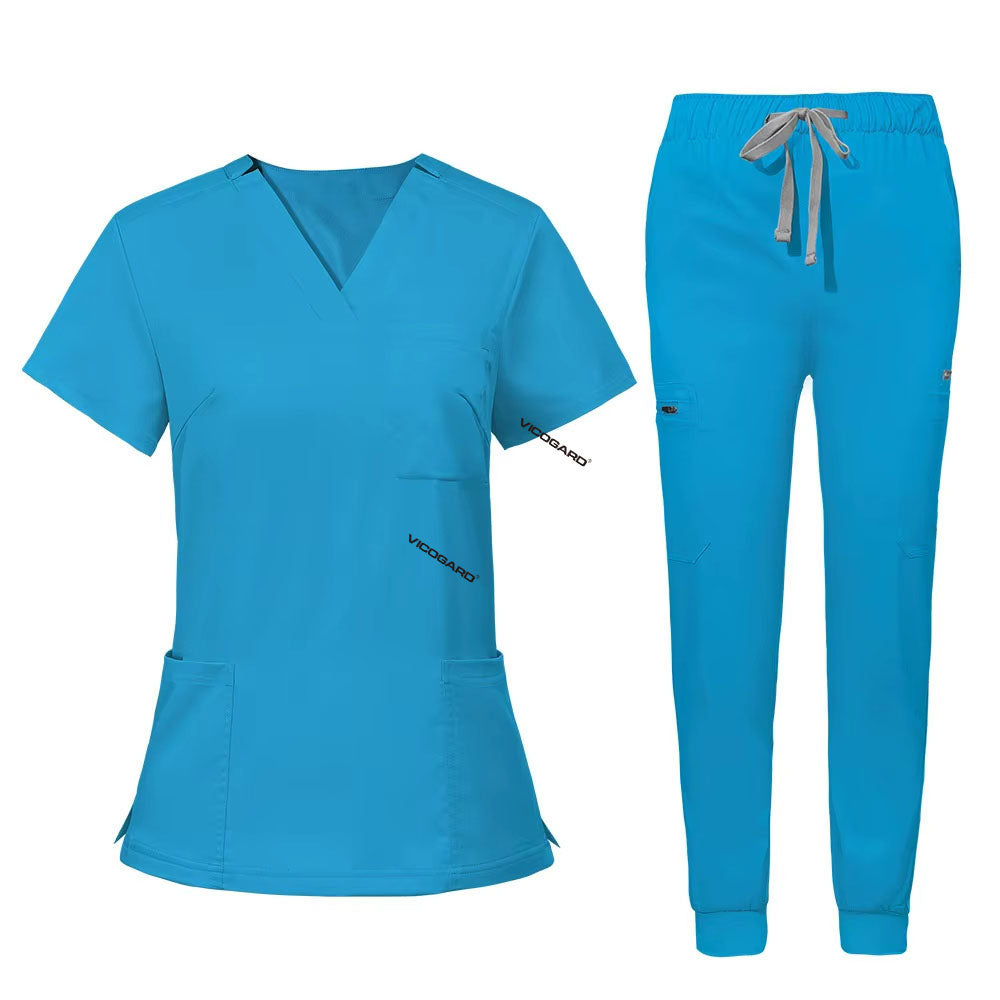 Flat lay of Royal Blue utility scrub set featuring 3-pocket top and 8-pocket jogger pants