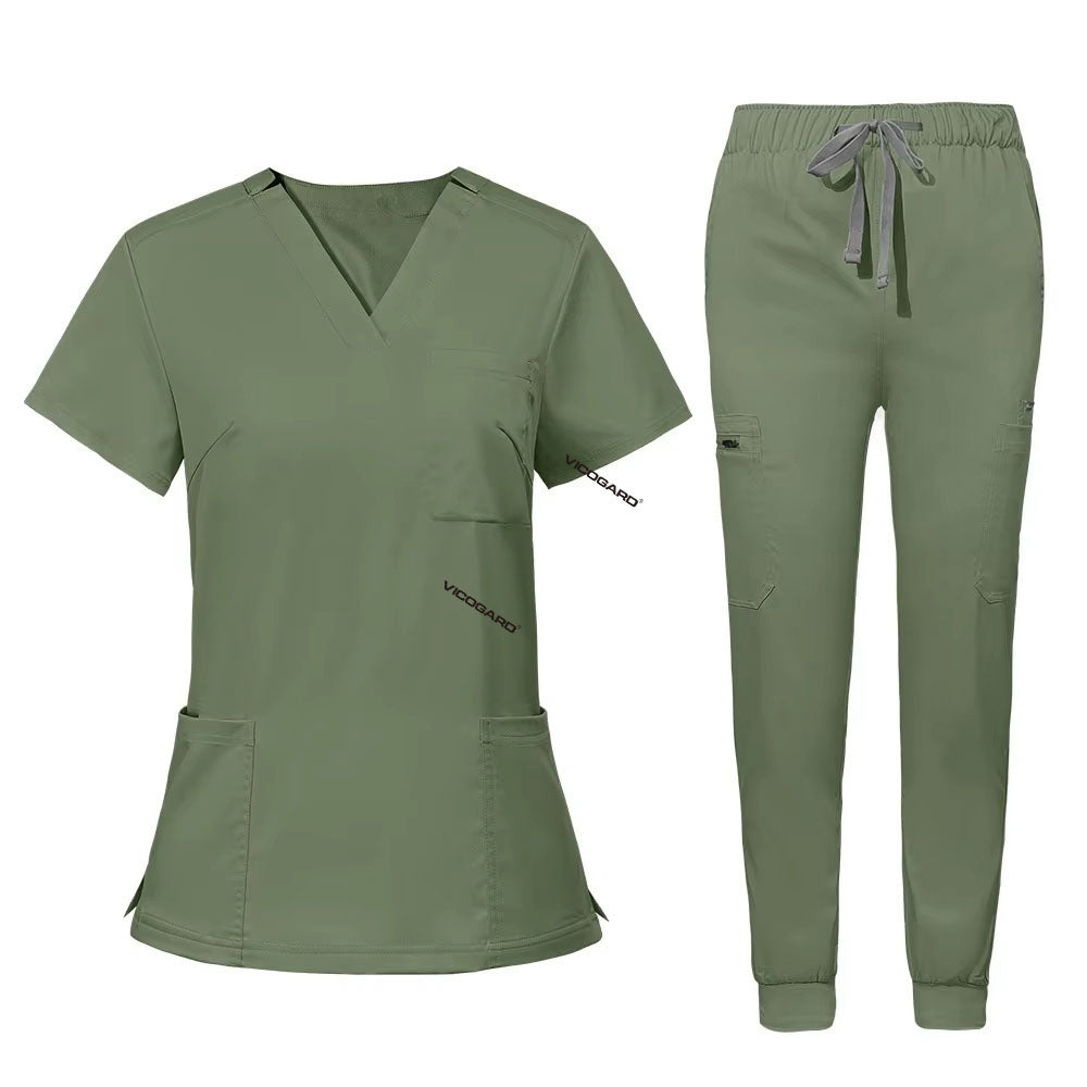 Flat lay of Fruit Green utility scrub set featuring 3-pocket top and 8-pocket jogger pants