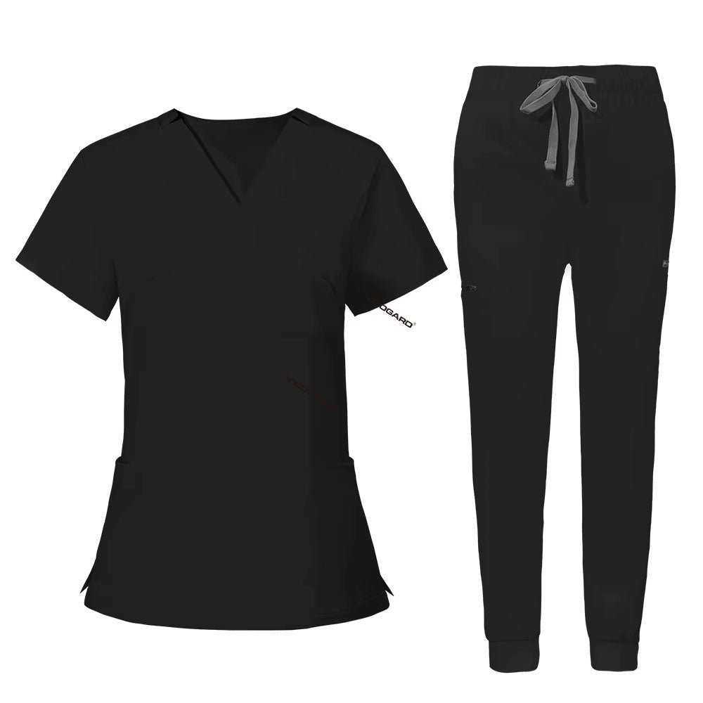 Flat lay of Black utility scrub set featuring 3-pocket top and 8-pocket jogger pants