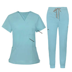 Flat lay of Ceil Blue utility scrub set featuring 3-pocket top and 8-pocket jogger pants