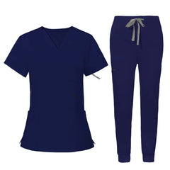 Flat lay of Navy Blue utility scrub set featuring 3-pocket top and 8-pocket jogger pants