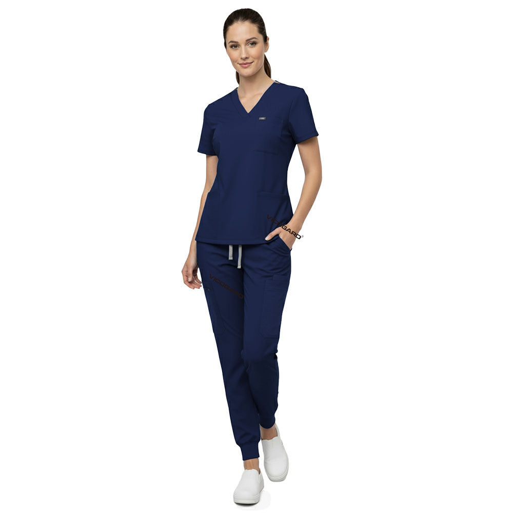 Model demonstrating deep cargo pocket storage on Navy Blue 8-pocket scrub joggers