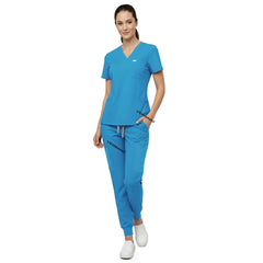 Model demonstrating deep cargo pocket storage on Royal Blue 8-pocket scrub joggers