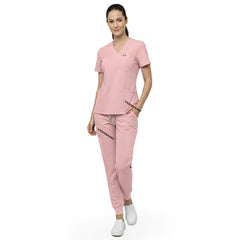 Model demonstrating deep cargo pocket storage on Pink 8-pocket scrub joggers