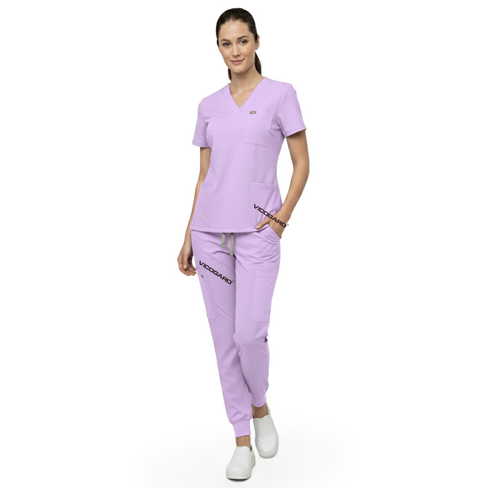 Model demonstrating deep cargo pocket storage on Lavender 8-pocket scrub joggers