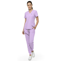 Model demonstrating deep cargo pocket storage on Lavender 8-pocket scrub joggers