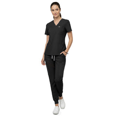 Model demonstrating deep cargo pocket storage on Black 8-pocket scrub joggers