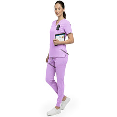 Side profile of caregiver holding medical tools wearing Lavender rayon scrubs showing athletic fit