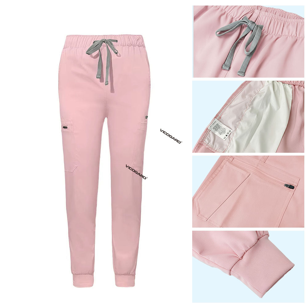 Detail of Pink jogger scrub pants showing ribbed ankle cuffs and rayon fabric texture